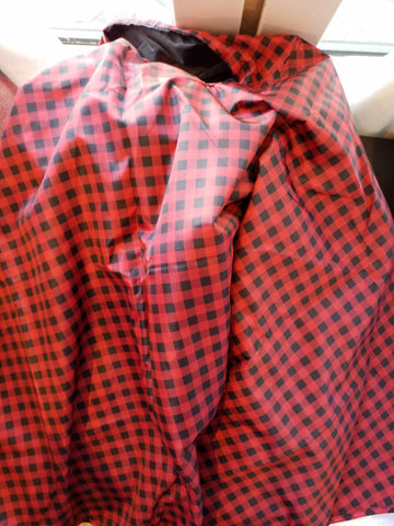 Reversible rain poncho red plaid/black